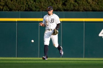 Aug 23, 2025; Detroit, Michigan, USA; Detroit Tigers outfielder Javier Báez (28) retrieves a ground ball hit by Kansas City Royals shortstop Bobby Witt Jr. (7) during the fifth inning at Comerica Park. Mandatory Credit: Brian Bradshaw Sevald-Imagn Images