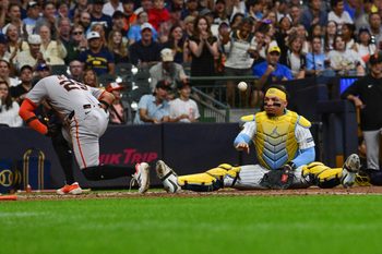 Aug 23, 2025; Milwaukee, Wisconsin, USA; Milwaukee Brewers catcher William Contreras (24) reacts after tagging out San Francisco Giants left fielder Luis Matos (29) trying to score in the sixth inning at American Family Field. Mandatory Credit: Benny Sieu-Imagn Images