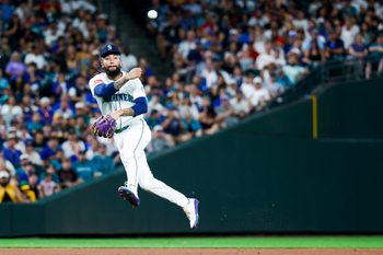 Aug 23, 2025; Seattle, Washington, USA; Seattle Mariners shortstop J.P. Crawford (3) throws to first base for an out against the Athletics during the ninth inning at T-Mobile Park. Mandatory Credit: Joe Nicholson-Imagn Images