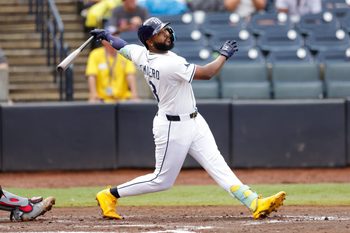 Aug 24, 2025; Tampa, Florida, USA; Tampa Bay Rays third baseman Junior Caminero (13) hits a grand slam against the St. Louis Cardinals in the fifth inning at George M. Steinbrenner Field. Mandatory Credit: Nathan Ray Seebeck-Imagn Images