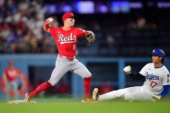 Aug 25, 2025; Los Angeles, California, USA; Los Angeles Dodgers two-way player Shohei Ohtani (17) is out at second as Cincinnati Reds second base Matt McLain (9) throws to first in a double play in the third inning at Dodger Stadium. Mandatory Credit: Gary A. Vasquez-Imagn Images