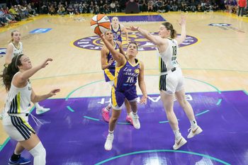 Aug 20, 2025; Los Angeles, California, USA; LA Sparks guard Kelsey Plum (10) shoots the ball against Dallas Wings center Luisa Geiselsoder (18) in the second half at Crypto.com Arena. Mandatory Credit: Kirby Lee-Imagn Images