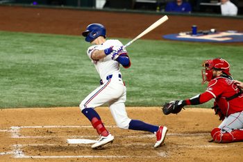 Aug 26, 2025; Arlington, Texas, USA; Texas Rangers center fielder Michael Helman (24) bats during the sixth inning against the Los Angeles Angels at Globe Life Field. Mandatory Credit: Kevin Jairaj-Imagn Images