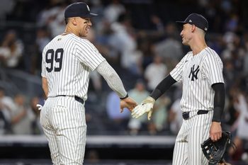 Aug 26, 2025; Bronx, New York, USA; New York Yankees designated hitter Aaron Judge (99) and left fielder Cody Bellinger (35) celebrate after defeating the Washington Nationals 5-1 at Yankee Stadium. Mandatory Credit: Wendell Cruz-Imagn Images