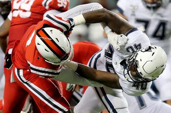 Cincinnati Bearcats cornerback Arquon Bush (9) and Connecticut Huskies tight end Jayce Medlock (40) entangle  in the fourth quarter of a college football game, Saturday, Nov. 9, 2019, at Nippert Stadium in Cincinnati.

Connecticut Huskies At Cincinnati Bearcats Nov 9
