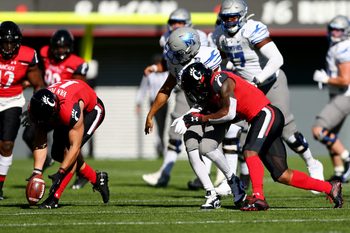Cincinnati Bearcats linebacker Ty Van Fossen (13), left, collects a forced fumble during the fourth quarter of a college football game against the Memphis Tigers, Saturday, Oct. 31, 2020, at Nippert Stadium in Cincinnati. The Cincinnati Bearcats won 49-10.

Memphis Tigers At Cincinnati Bearcats Oct 31