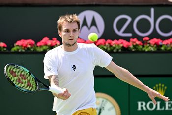 Mar 13, 2022; Indian Wells, CA, USA;  Alexander Bublik (KAZ) hits a shot against Andy Murray (GBR) during a second round match at the BNP Paribas Open at the Indian Wells Tennis Garden. Mandatory Credit: Jayne Kamin-Oncea-Imagn Images