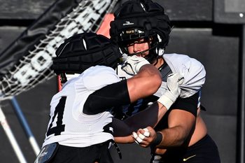 Vanderbilt linebacker Langston Patterson, right, runs through a blocking drill with Nicholas Rinaldi (24) before an NCAA college football scrimmage Saturday, Aug. 10, 2024, in Nashville, Tenn.
