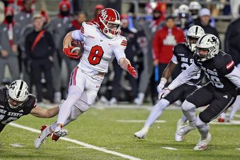 Western Kentucky's Easton Messer tries to evade the tackle of Jacksonville State's Walker O'Steen during the C-USA Championship at AmFirst Stadium in Jacksonville, Alabama , Alabama December 6, 2024. (Dave Hyatt / Hyatt Media LLC)