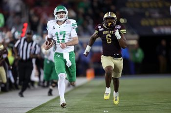 Jan 3, 2025; Dallas, TX, USA; North Texas Mean Green quarterback Drew Mestemaker (17) scores a touchdown against the Texas State Bobcats during the fourth quarter at Gerald J. Ford Stadium. Mandatory Credit: Tim Heitman-Imagn Images