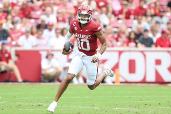 Aug 30, 2025; Fayetteville, Arkansas, USA; Arkansas Razorbacks quarterback Taylen Green (10) rushes during the first quarter against the Alabama A&M Bulldogs at Donald W. Reynolds Razorback Stadium. Mandatory Credit: Nelson Chenault-Imagn Images