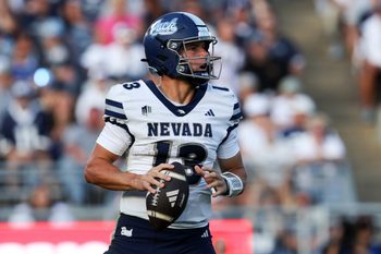 Aug 30, 2025; University Park, Pennsylvania, USA; Nevada Wolf Pack quarterback Chubba Purdy (13) drops back in the pocket while looking to throw the ball during the third quarter against the Penn State Nittany Lions at Beaver Stadium. Penn State defeated Nevada 46-9. Mandatory Credit: Matthew O'Haren-Imagn Images