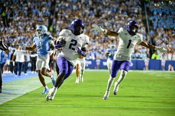 Sep 1, 2025; Chapel Hill, North Carolina, USA; TCU Horned Frogs running back Kevorian Barnes (2) scores a touchdown as safety Austin Jordan (1) celebrates and North Carolina Tar Heels defensive back Thaddeus Dixon (1) defends in the third quarter at Kenan Stadium. Mandatory Credit: Bob Donnan-Imagn Images
