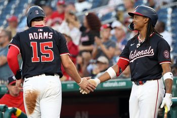 Sep 2, 2025; Washington, District of Columbia, USA; Washington Nationals catcher Riley Adams (15) celebrates with Washington Nationals shortstop CJ Abrams (5) after scoring a run during the second inning against the Miami Marlins at Nationals Park. Mandatory Credit: Daniel Kucin Jr.-Imagn Images