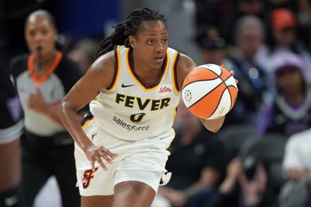 Aug 31, 2025; San Francisco, California, USA; Indiana Fever guard Kelsey Mitchell (0) dribbles against the Golden State Valkyries during the third quarter at Chase Center. Mandatory Credit: Darren Yamashita-Imagn Images