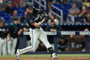 Sep 5, 2025; Miami, Florida, USA; Miami Marlins shortstop Jack Winkler (63) hits a double against the Philadelphia Phillies during the eighth inning at loanDepot Park. Mandatory Credit: Sam Navarro-Imagn Images