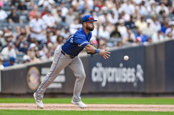 Sep 6, 2025; Bronx, New York, USA; Toronto Blue Jays shortstop Bo Bichette (11) tosses the ball to second base to get a force out against New York Yankees first baseman Ben Rice (not pictured) during the fifth inning at Yankee Stadium. Mandatory Credit: John Jones-Imagn Images
