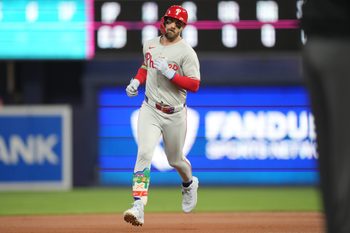 Sep 6, 2025; Miami, Florida, USA;  Philadelphia Phillies first baseman Bryce Harper (3) hits a two-run home run in the first inning against the Miami Marlins at loanDepot Park. Mandatory Credit: Jim Rassol-Imagn Images