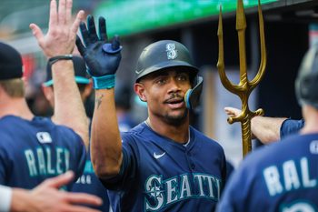 Sep 6, 2025; Cumberland, Georgia, USA; Seattle Mariners outfielder Julio Rodriguez (44) celebrates with teammates in the dugout after scoring against the Atlanta Braves during the first inning at Truist Park. Mandatory Credit: Jordan Godfree-Imagn Images