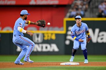 Sep 7, 2025; Arlington, Texas, USA; Texas Rangers second baseman Cody Freeman (39) tosses the ball to shortstop Ezequiel Duran (20) as the turn a double play during the game against the Houston Astros at Globe Life Field. Mandatory Credit: Jerome Miron-Imagn Images