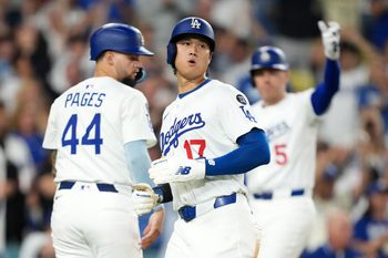 Sep 8, 2025; Los Angeles, California, USA; Los Angeles Dodgers designated hitter Shohei Ohtani (17) scores in the seventh inning against the Colorado Rockies as Dodgers center fielder Andy Pages (44) and first baseman Freddie Freeman (5) watch at Dodger Stadium. Mandatory Credit: Kirby Lee-Imagn Images