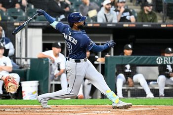 Sep 9, 2025; Chicago, Illinois, USA;  Tampa Bay Rays third baseman Junior Caminero (13) doubles during the second inning against the Chicago White Sox at Rate Field. Mandatory Credit: Matt Marton-Imagn Images