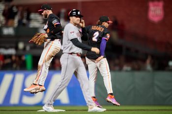 Sep 9, 2025; San Francisco, California, USA; San Francisco Giants infielders Casey Schmitt (10) and Willy Adames (2) leap to celebrate as Arizona Diamondbacks catcher Adrian Del Castillo (25) walks off the field after the last out of the game at Oracle Park. Mandatory Credit: Robert Edwards-Imagn Images