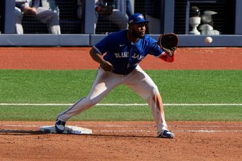 Sep 11, 2025; Toronto, Ontario, CAN; Toronto Blue Jays first baseman Vladimir Guerrero Jr. (27) gets Houston Astros center fielder Mauricio Dubon (not pictured) out at first base during the sixth inning at Rogers Centre. Mandatory Credit: John E. Sokolowski-Imagn Images