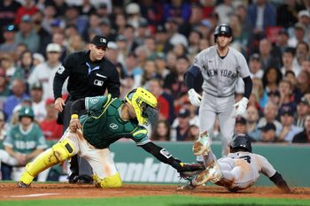 Sep 12, 2025; Boston, Massachusetts, USA; Boston Red Sox catcher Carlos Narvaez (75) tags out New York Yankees second baseman Jazz Chisholm Jr (13) during the eighth inning at Fenway Park. Mandatory Credit: Paul Rutherford-Imagn Images