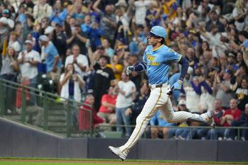 Sep 12, 2025; Milwaukee, Wisconsin, USA; Milwaukee Brewers outfielder Christian Yelich (22) hits a home run against the St. Louis Cardinals in the seventh inning at American Family Field. Mandatory Credit: Michael McLoone-Imagn Images