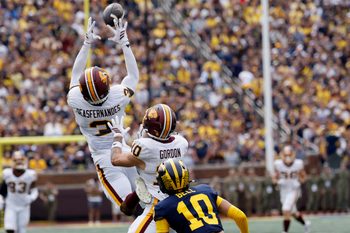 Sep 13, 2025; Ann Arbor, Michigan, USA;  Central Michigan Chippewas defensive back Brenden Deasfernandes (3) makes an interception in the first half against the Michigan Wolverines at Michigan Stadium. Mandatory Credit: Rick Osentoski-Imagn Images