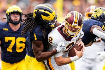 Michigan linebacker Jaishawn Barham (1) sacks Central Michigan quarterback Joe Labas (2) during the first half at Michigan Stadium in Ann Arbor on Saturday, Sept. 13, 2025.