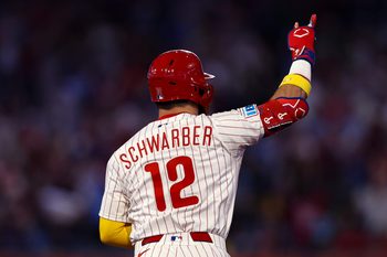 Sep 13, 2025; Philadelphia, Pennsylvania, USA; Philadelphia Phillies outfielder Kyle Schwarber (12) reacts to his home run against the Kansas City Royals during the fifth inning at Citizens Bank Park. Mandatory Credit: Bill Streicher-Imagn Images
