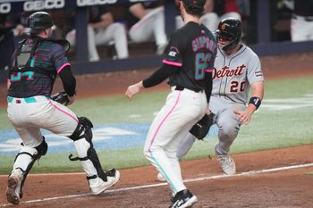 Sep 13, 2025; Miami, Florida, USA;  Miami Marlins catcher Liam Hicks (34) runs down Detroit Tigers first baseman Spencer Torkelson (20) at home plate in the 11th inning at loanDepot Park. Mandatory Credit: Jim Rassol-Imagn Images