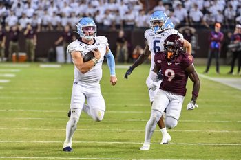Sep 13, 2025; Blacksburg, Virginia, USA;  Old Dominion Monarchs quarterback Colton Joseph (1) runs the ball as Virginia Tech Hokies cornerback Isaiah Brown-Murray (9) pursues during the third quarter at Lane Stadium. Mandatory Credit: Brian Bishop-Imagn Images