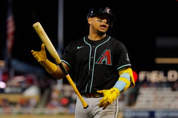 Sep 13, 2025; Minneapolis, Minnesota, USA; Arizona Diamondbacks catcher Gabriel Moreno (14) dislikes the called third strike against him and for the Minnesota Twins in the eighth inning at Target Field. Mandatory Credit: Bruce Kluckhohn-Imagn Images