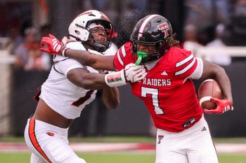 Texas Tech's Terrance Carter Jr. is met by Oregon State's Dexter Foster during a non-conference football game, Saturday, Sept. 13, 2025, at Jones AT&T Stadium.