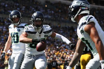 Sep 14, 2025; Pittsburgh, Pennsylvania, USA;  Seattle Seahawks tight end AJ Barner (88) reacts with wide receivers Cooper Kupp (10) and Jaxon Smith-Njigba (right) after catching a touchdown pass against the Pittsburgh Steelers during the third quarter at Acrisure Stadium. Mandatory Credit: Charles LeClaire-Imagn Images