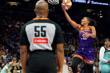 Sep 14, 2025; Phoenix, Arizona, USA; Phoenix Mercury forward Alyssa Thomas (25) drives and scores in the paint during the first half against the New York Liberty during game one of the 2025 WNBA Playoffs round one at PHX Arena. Mandatory Credit: Allan Henry-Imagn Images