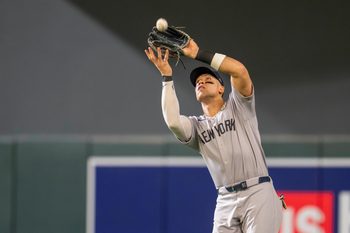 Sep 15, 2025; Minneapolis, Minnesota, USA; New York Yankees right fielder Aaron Judge (99) catches a fly ball against the Minnesota Twins in the fifth inning at Target Field. Mandatory Credit: Jesse Johnson-Imagn Images