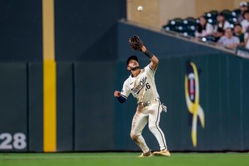 Sep 16, 2025; Minneapolis, Minnesota, USA; Minnesota Twins second baseman Austin Martin (16) catches a fly ball against the New York Yankees in the ninth inning at Target Field. Mandatory Credit: Jesse Johnson-Imagn Images