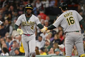Sep 17, 2025; Boston, Massachusetts, USA; Athletics center fielder Lawrence Butler (4) celebrates scoring a run against the Boston Red Sox with first baseman Nick Kurtz (16) during the second inning at Fenway Park. Mandatory Credit: Eric Canha-Imagn Images