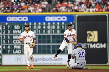 Sep 17, 2025; Houston, Texas, USA; Houston Astros second baseman Jose Altuve (27) forces Texas Rangers shortstop Ezequiel Duran (20) out at second base and turns the double play in the eighth inning at Daikin Park. Mandatory Credit: Thomas Shea-Imagn Images
