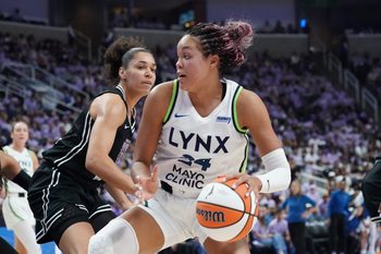 Sep 17, 2025; San Jose, California, USA; Minnesota Lynx forward Napheesa Collier (24) dribbles against Golden State Valkyries forward Janelle Salaun (13) in the third quarter in game two of round one for the 2025 WNBA Playoffs at SAP Center. Mandatory Credit: David Gonzales-Imagn Images