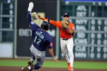 Sep 19, 2025; Houston, Texas, USA; Houston Astros shortstop Jeremy Pena (3) throws a fielded ball to first base after tagging out Seattle Mariners first baseman Josh Naylor (12) during the sixth inning at Daikin Park. Mandatory Credit: Erik Williams-Imagn Images