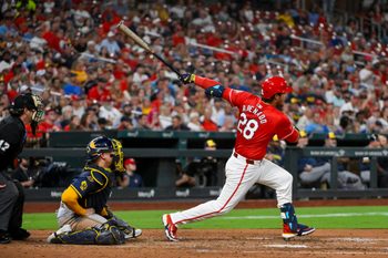 Sep 19, 2025; St. Louis, Missouri, USA;  St. Louis Cardinals third baseman Nolan Arenado (28) hits a three run double against the Milwaukee Brewers during the fifth inning at Busch Stadium. Mandatory Credit: Jeff Curry-Imagn Images