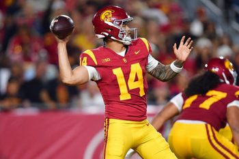 Sep 20, 2025; Los Angeles, California, USA; Southern California Trojans quarterback Jayden Maiava (14) throws against the Michigan State Spartans during the first half at the Los Angeles Memorial Coliseum. Mandatory Credit: Gary A. Vasquez-Imagn Images