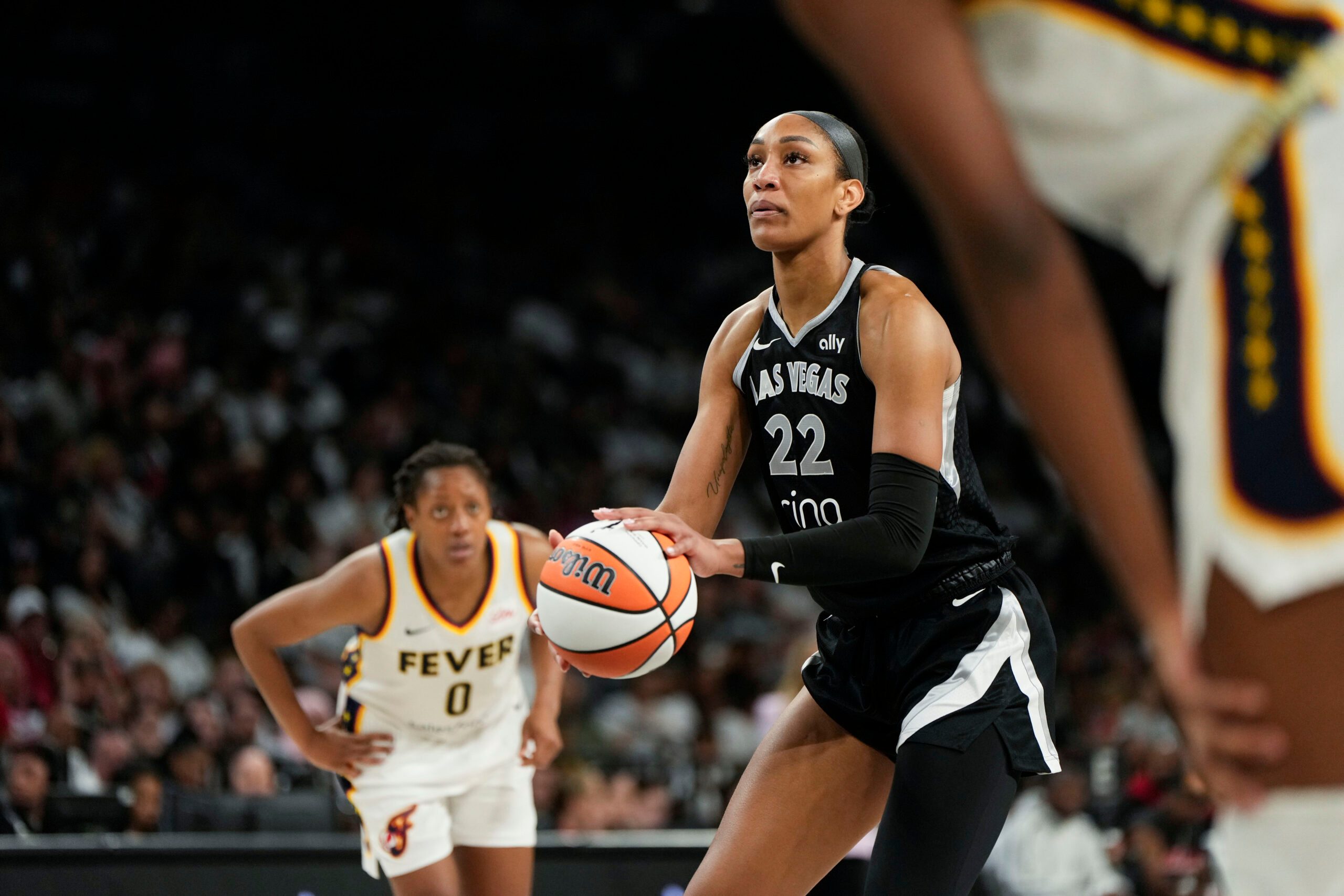 Sep 21, 2025; Las Vegas, Nevada, USA; Las Vegas Aces center A'ja Wilson (22) shoots a free throw during the third quarter in game one of the second round for the 2025 WNBA Playoffs against the Indiana Fever at Michelob Ultra Arena. Mandatory Credit: Lucas Peltier-Imagn Images
