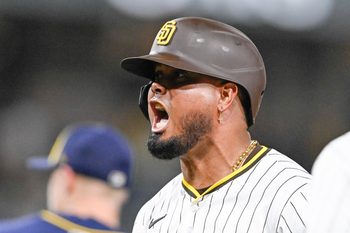 Sep 22, 2025; San Diego, California, USA; San Diego Padres first baseman Luis Arraez (4) celebrates after hitting an RBI single during the seventh inning against the Milwaukee Brewers at Petco Park. Mandatory Credit: Denis Poroy-Imagn Images