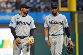 Sep 23, 2025; Philadelphia, Pennsylvania, USA; Miami Marlins shortstop Xavier Edwards (9) and second base Otto Lopez (6) celebrate win against the Philadelphia Phillies at Citizens Bank Park. Mandatory Credit: Eric Hartline-Imagn Images